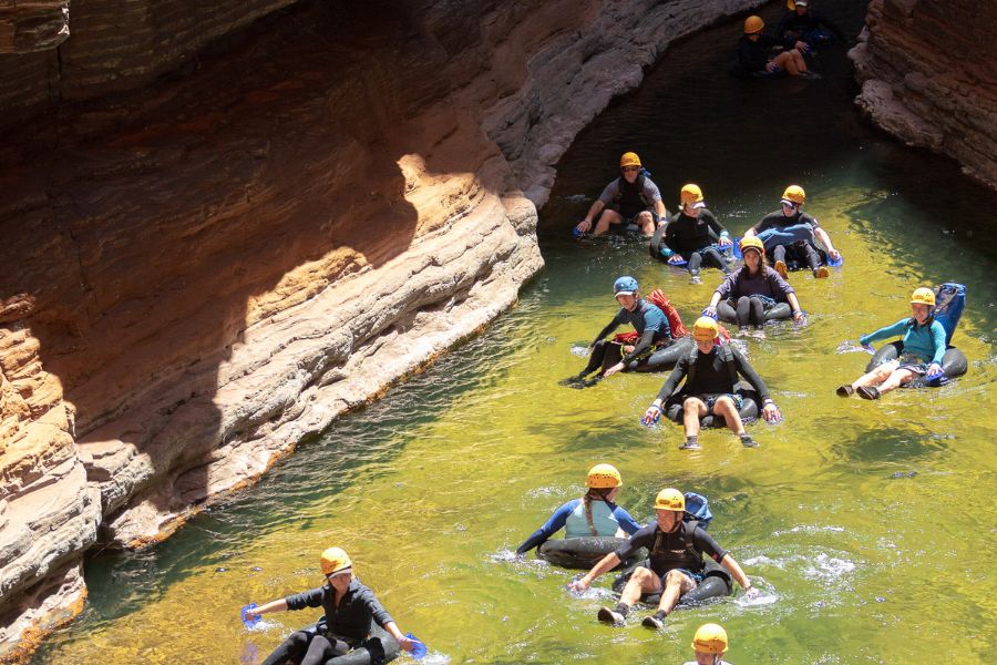 Group canyoning together in a narrow gorge in Karijini National Park
