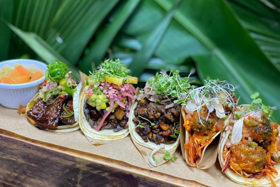 Vegan tacos with seitan, soyrizo, cauliflower adobo, and fresh toppings in Trinidad and Tobago