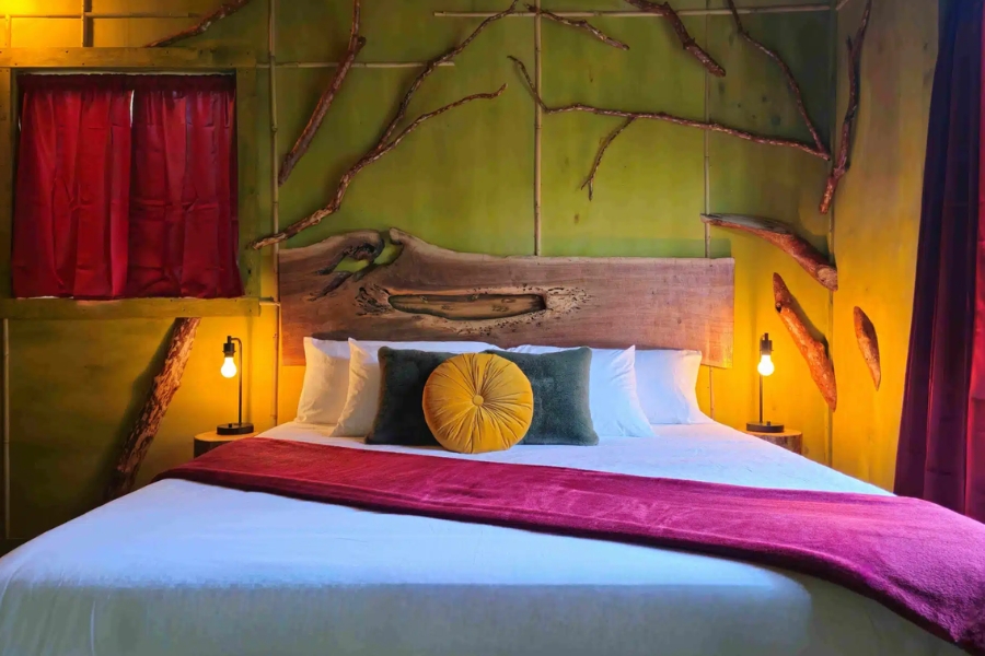 Cozy bedroom at Raven’s Retreat Hocking Hills, a vegan wellness retreat Ohio guests can visit for rest and nature.