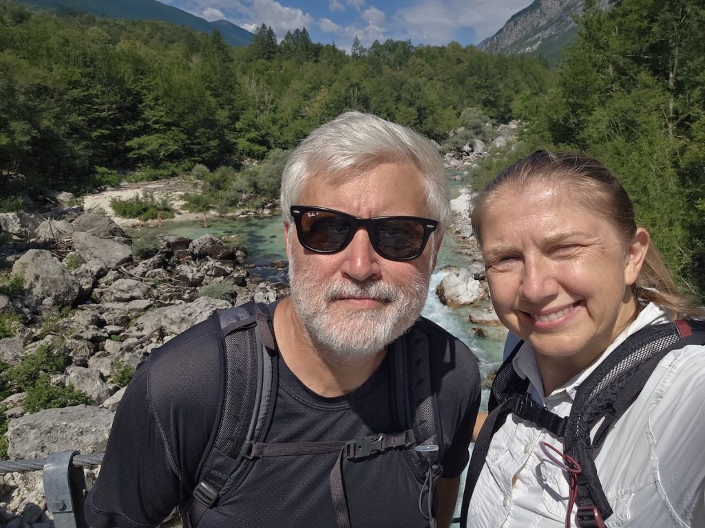Brighde and Seb hiking beside the Soča River in Slovenia
