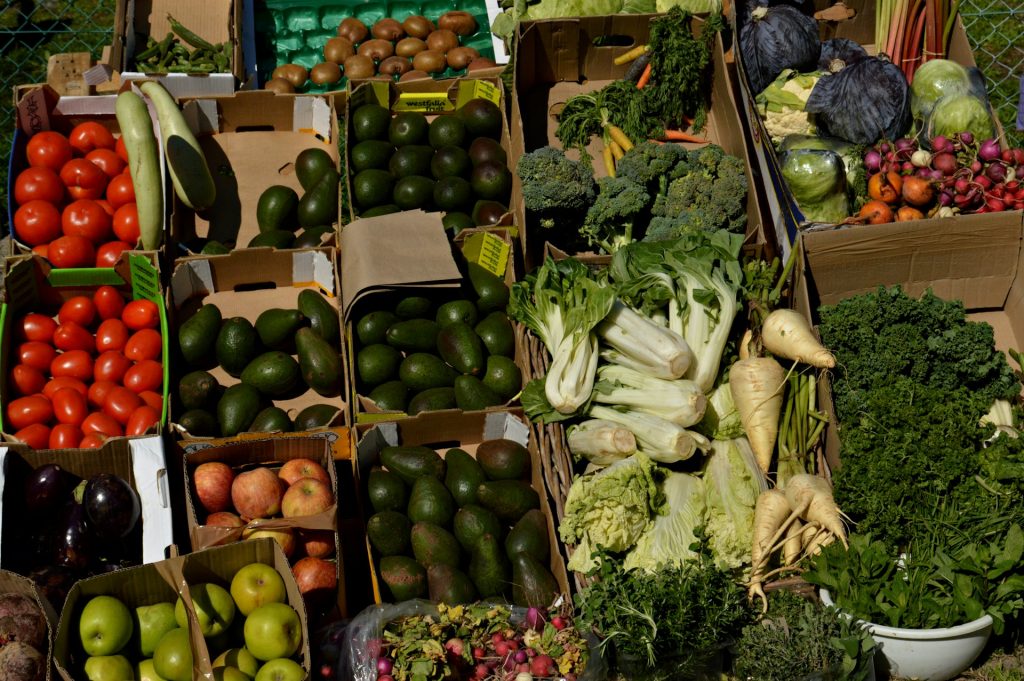 Fresh vegetables and produce at a Cape Town market showcasing ingredients used in African plant-based cuisine