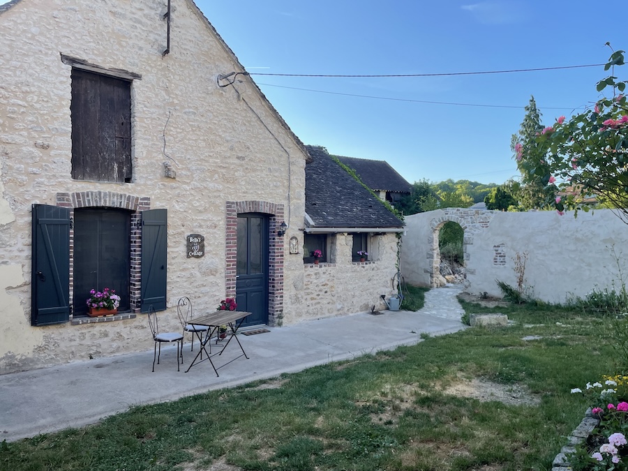 Bella’s Cottage and courtyard at La Grange DesRochers vegan B&B in France