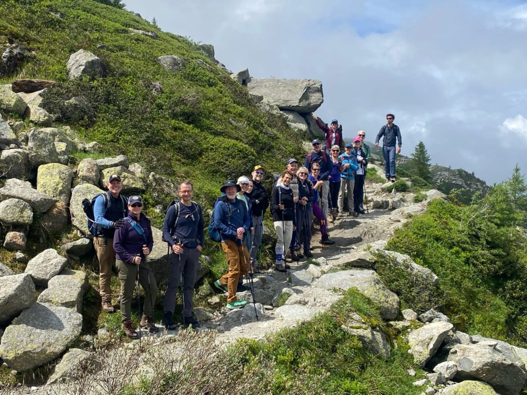 Hiking group together on a rocky Alpine trail