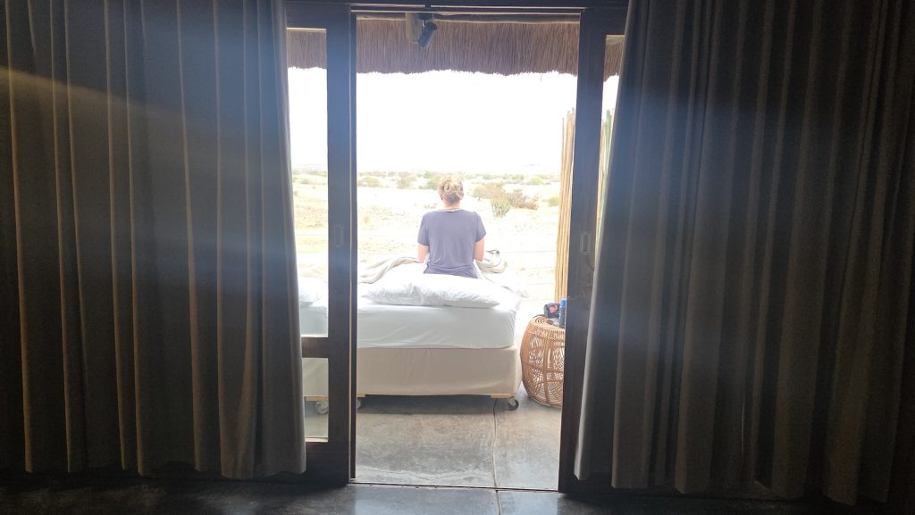 Bed rolled onto the outdoor deck at Wilderness Doro Nawas in Namibia