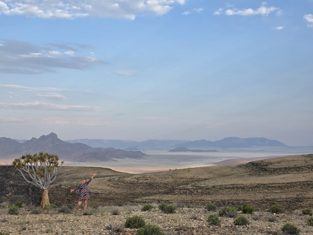 Brighde overlooking the vast Namib Desert landscape in Namibia