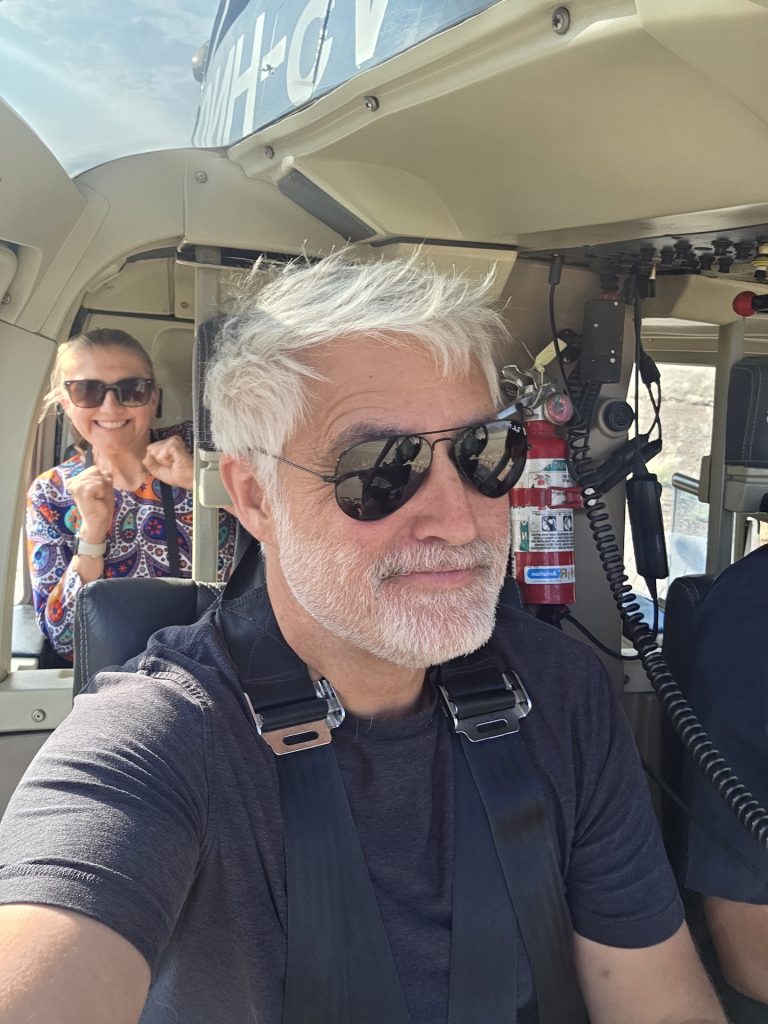 Seb and Brighde inside a helicopter during their Namib Desert flight